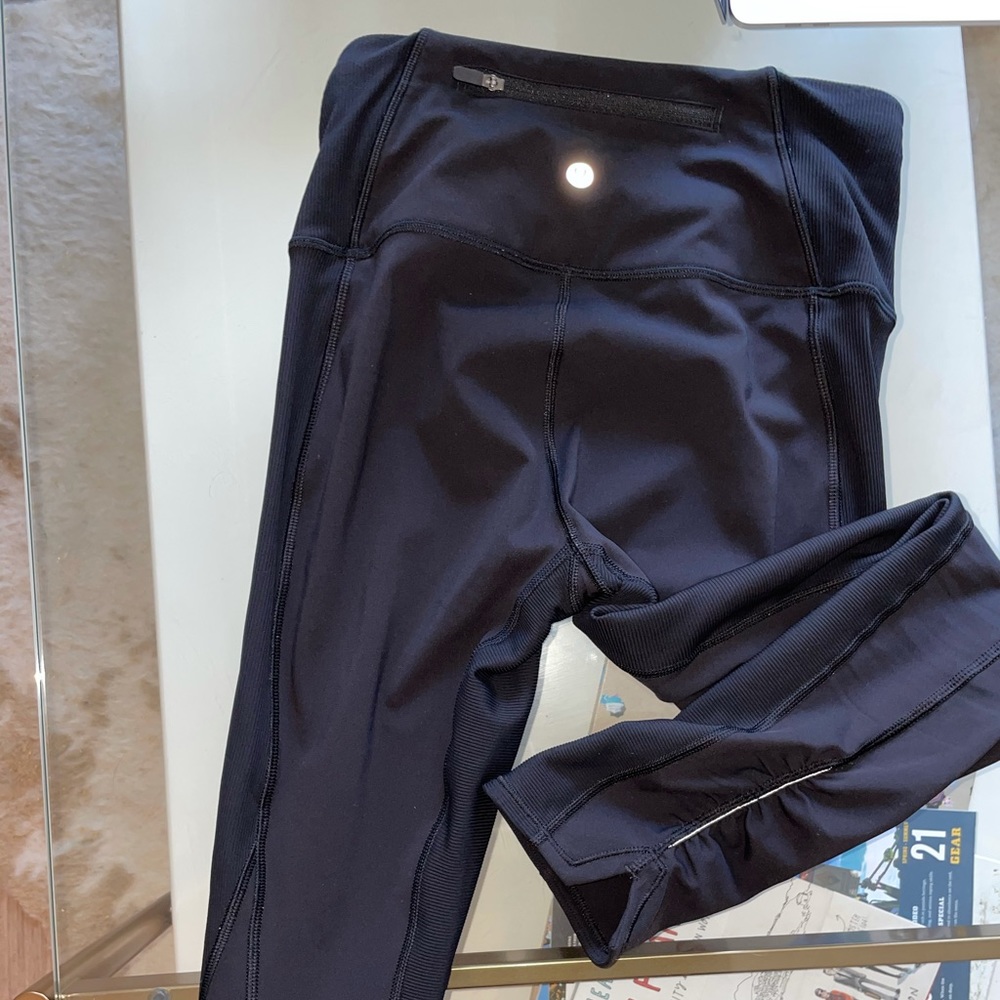 Black lulu lemon leggings/detailing at the ankles